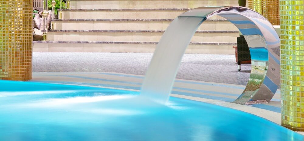 Water features add the luxurious feel to your swimming pool